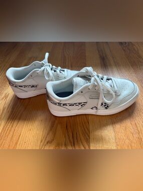 Reebok Women’s White Sneakers with Black Leopard Accent